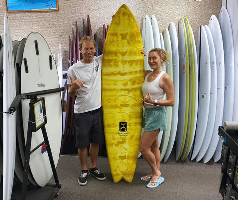 Dr. Erin Gilbert on her seaside and beyond surfboard