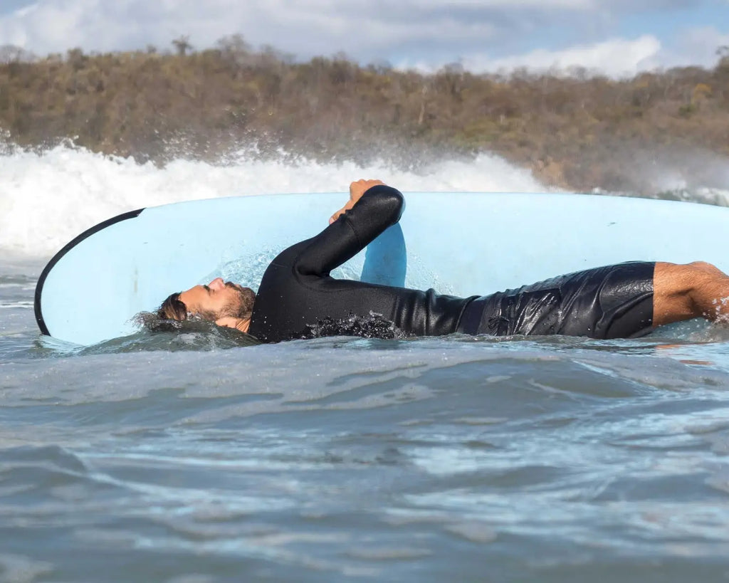 How to Paddle a Longboard and Navigate Waves