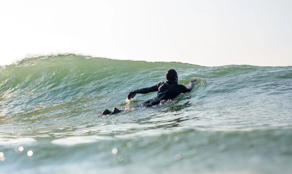 How to Paddle a Longboard and Navigate Waves